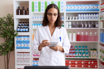 Sticker - Young african american woman pharmacist counting dollars at pharmacy