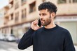 © Krakenimages.com - Young arab man smiling confident talking on the smartphone at street
