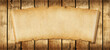 Old paper horizontal banner. Parchment scroll on a wood board