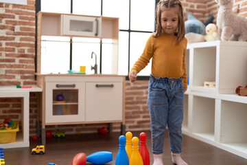 Poster - Adorable hispanic girl smiling confident playing bowling at kindergarten