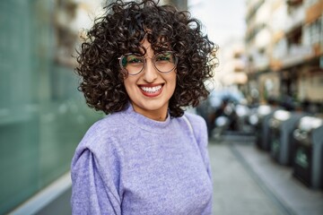 Sticker - Young middle east woman smiling confident wearing glasses at street