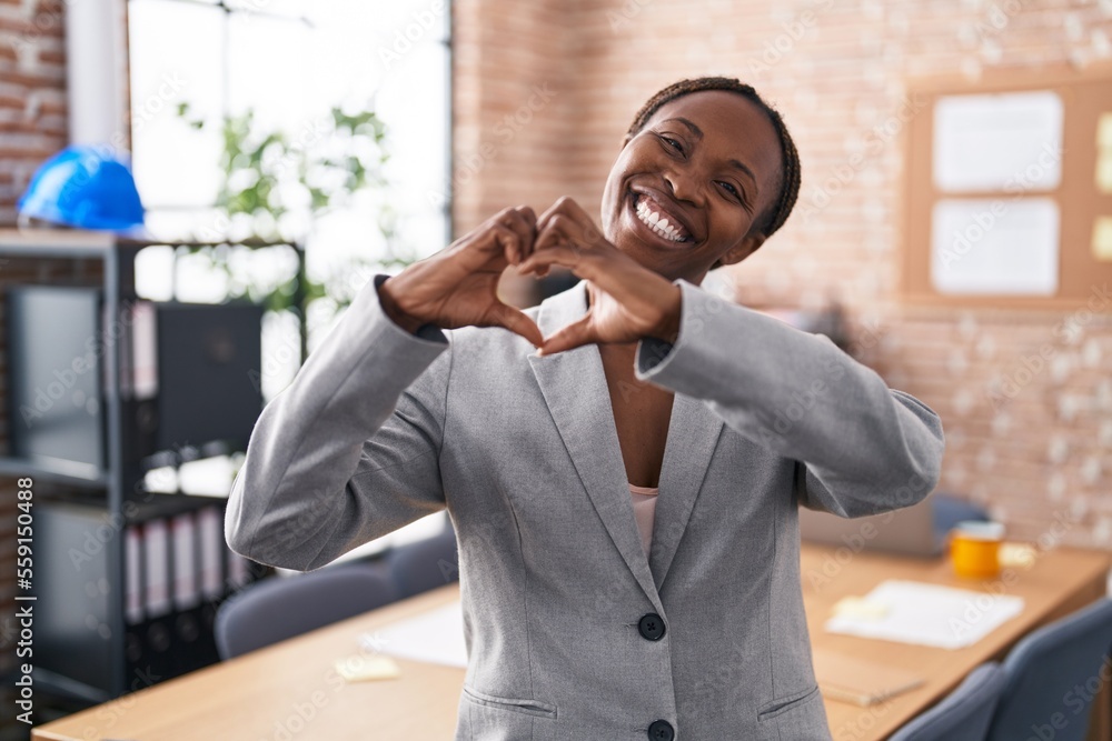 African american woman at the office smiling in love showing heart ...