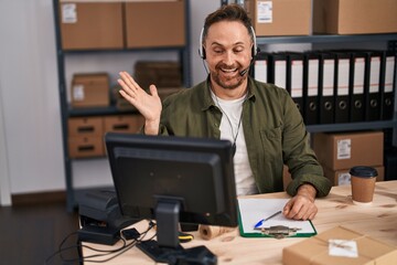 Sticker - Middle age caucasian man working at small business ecommerce wearing headset celebrating achievement with happy smile and winner expression with raised hand