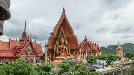 Wall Mural - Scenery of golden pagoda with big buddha on hill at Wat Tham Sua