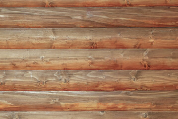 Wall Mural - Wooden log house as a background.Wooden background from round logs with natural wood pattern