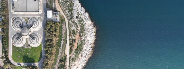 Aerial drone ultra wide photo of latest technology sewage treatment plant and sludge drying facilities located in Mediterranean island