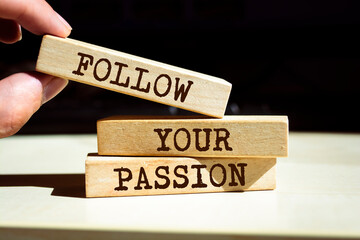 Wall Mural - Wooden blocks with words 'Follow Your Passion'.