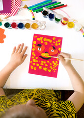 Wall Mural - Child making homemade greeting card from paper. Gift for Mothers day, Fathers day, Birthday or Valentines day.  Kid craft. Home Education game. development concept