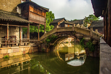 Wall Mural - Stone Bridge and traditional Chinese wooden house in Wuzhen Village in the morning