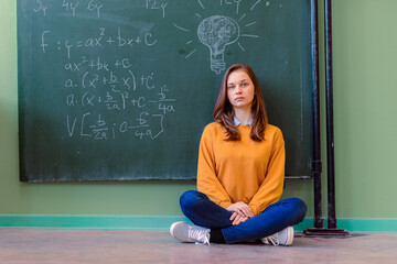 Wall Mural - Teenager girl in math class overwhelmed by the math formula. Pressure, Education, Success concept.