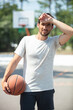 © auremar - sweating basketball player in the park