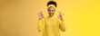 Count it done. Assured confident african-american woman in sweater headband show okay ok no worries gesture smiling self-assured plan goes fine, pleased good results, cheering yellow background
