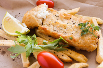 grilled fish and chips battered hake with fried hot chips 