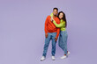 Full body young lovely couple two friends family man woman of African American ethnicity wearing casual clothes together husband hugging smiling wife isolated on pastel plain light purple background.