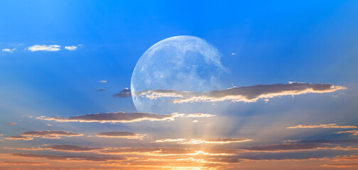 Wall Mural - night sky with moon in the clouds at sunset 