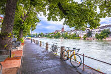 Basel. Rhine River Green Waterfront And Basel Minster View