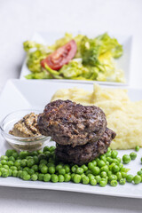 Wall Mural - bavarian meat loafs with peas