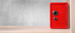 © New Africa - Red steel safe with mechanical combination lock on shelf, banner design. Space for text