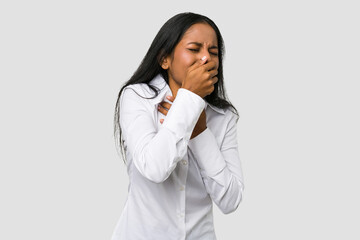 Wall Mural - Young Indian woman cut out isolated on white background suffers pain in throat due a virus or infection.