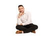 © Asier - Adult latin man sitting on the floor cut out isolated smiling happy and confident, touching chin with hand.