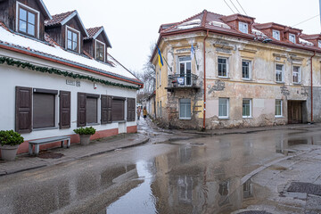 Wall Mural - View of Uzupis Neighborhood buildings and streets in winter surrounded by Vilnia River, Vilnius, Lithuania