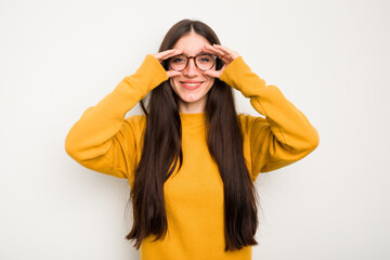 Wall Mural - Young caucasian woman isolated on white background showing okay sign over eyes