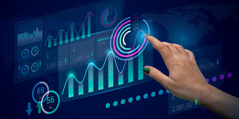 Analysis of the client base, Internet marketing, and increasing sales. Manager's hand and abstract charts and pie charts on a dark blue background. Processing and storage of data on Internet