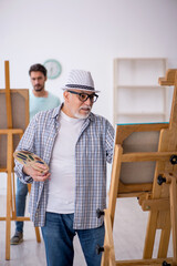 Canvas Print - Two male painters enjoying painting at home