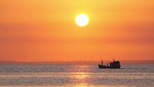 Sunset Landscape When Fishing Boat Out To Sea To Harvest Fish End The Day.