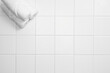 © gru pictures - bathroom object on white tile background, top view and copy space