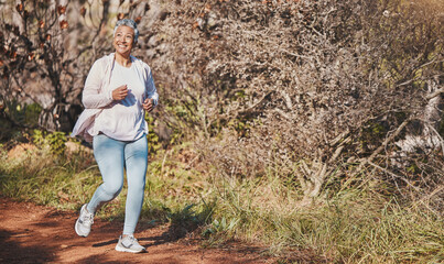 Wall Mural - Fitness, happy and senior woman running in nature for cardio, morning motivation and marathon training in Australia. Freedom, wellness and elderly runner with a smile for outdoor exercise in a park