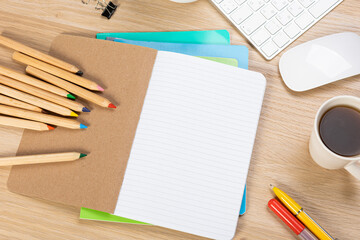 Wall Mural - Notebook mockup with school stationery on a wooden table. back to school concept. Blank notepad with copy space. list of goals and plans for new year 2023