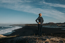 Woman Standing With Hands On Hip At Janubio Beach, Lanzarote, Canary Islands, Spain