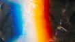 Leinwandbild Motiv Aged film texture. Dust scratches noise. Weathered foil. Orange blue white rainbow color light flare on dark crushed grunge abstract background.