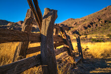Organ Mountains, Desert Peaks National Monument In Las Cruces, Doña Ana County, New Mexico, Southwestern USA, Weathered Wooden Ranch Fence, Golden Grasses In Meadow At Dripping Springs Natural Area. 