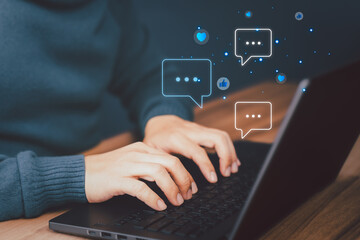 adult man using a computer laptop typing live chat chatting on application communication digital web