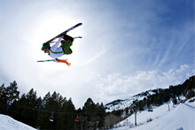A Man Dressed As An Irish Leprechaun Jumps On His Skis In Wyoming.