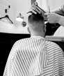 © jozzeppe777 - barber cuts the client's scissors