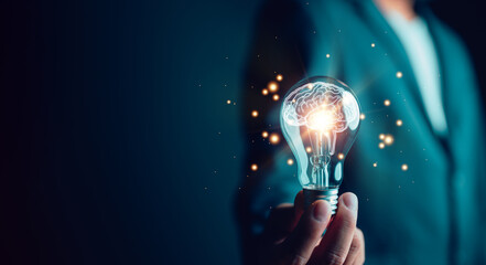 new idea innovation concept, man holding light bulbs with brain inside. creative and innovation insp