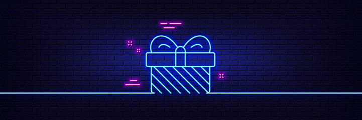 Wall Mural - Neon light glow effect. Gift box line icon. Christmas or New year present sign. Surprise symbol. 3d line neon glow icon. Brick wall banner. Gift outline. Vector