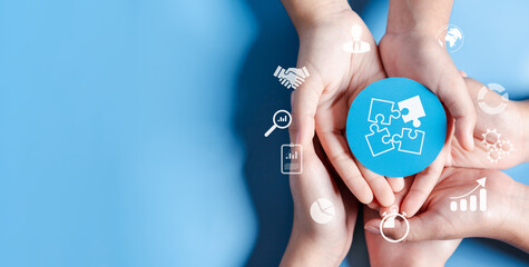 Leinwandbilder - Hands holding jigsaw solution business target planning development leadership and customer target group, investment growth and success development, achievement, goal, strategy, finance concept.