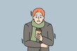 Unhappy young man in outerwear hold takeaway coffee freezing outdoors. Distressed guy with warm drink in hands suffer from cold weather. Vector illustration. 