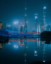 View Of Shanghai Skyline At Night Over The Bay And The River, China.