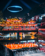 View Of A Beautiful Temple In A Small Village During The Light Show Across The River At Night, Mlaozhai Village, Guizhou Province, China.