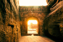 Beautiful Sunlight Coming Out Of Badami Fort ,gateway To Lower Shivalaya Temple During Sunset.