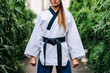 © ADDICTIVE STOCK - Anonymous professional TKD master standing on street