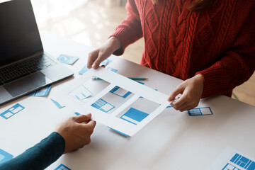 designer, programmers, developers of mobile applications work together to invent a modern mobile app