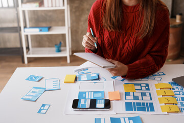 designer, programmers, developers of mobile applications work together to invent a modern mobile app