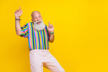 Photo Of Funky Good Mood Man Wear Colorful Shirt Rising Having Fun Pointing Fingers Up Empty Space Isolated Yellow Color Background