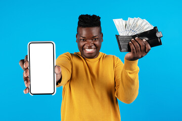 Wall Mural - Cheerful Black Male Demonstrating Blank Smartphone And Wallet With Dollar Cash Money